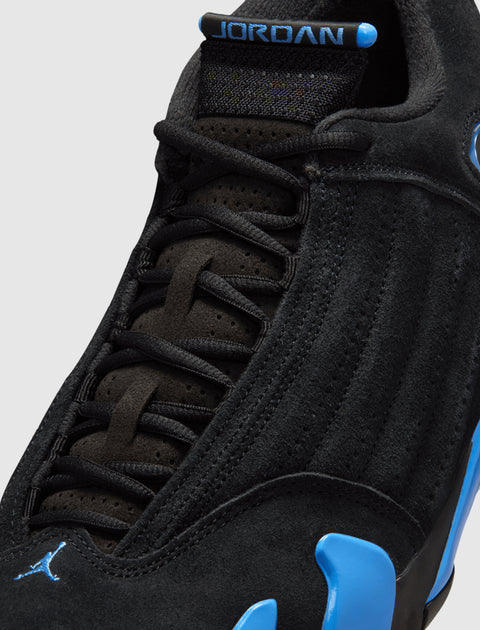 Close-up of black and blue suede sneaker with visible Jordan branding and laces