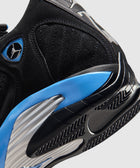 Close-up of black and blue suede sneaker with textured sole and Jumpman logo detailing