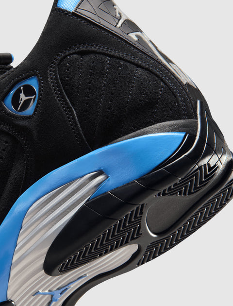 Close-up of black and blue suede sneaker with textured sole and Jumpman logo detailing