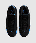 Top view of black and blue suede sneakers with visible Jumpman logo on tongues and toes