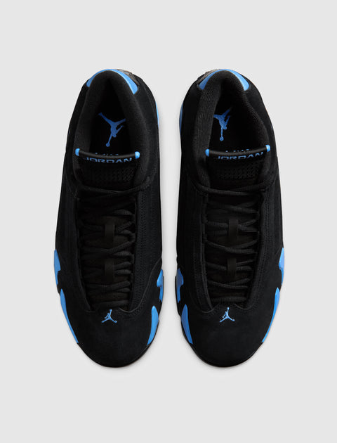 Top view of black and blue suede sneakers with visible Jumpman logo on tongues and toes
