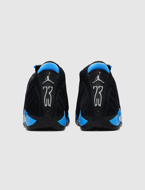 Back view of black and blue suede sneakers with silver 23 and Jumpman logos