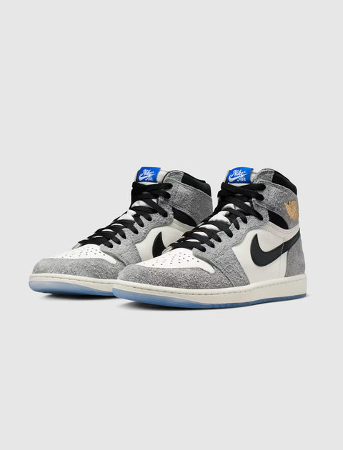 High-top sneakers with grey textured suede, white leather panels, black swoosh, and blue accents