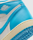 Close-up of blue and white Air Jordan sneaker heel with textured sole and stitched accents.
