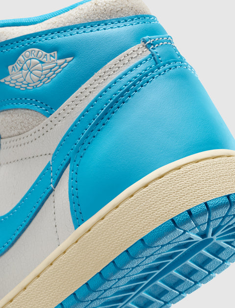 Close-up of blue and white Air Jordan sneaker heel with textured sole and stitched accents.
