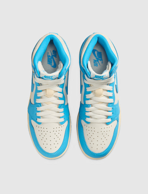 Pair of blue and white high-top Nike sneakers with perforated toes, viewed from above
