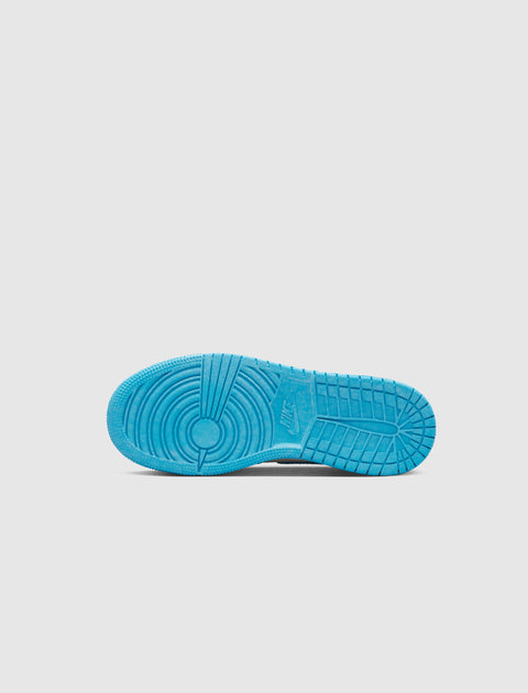 Blue Nike sneaker sole with circular tread pattern on a white background