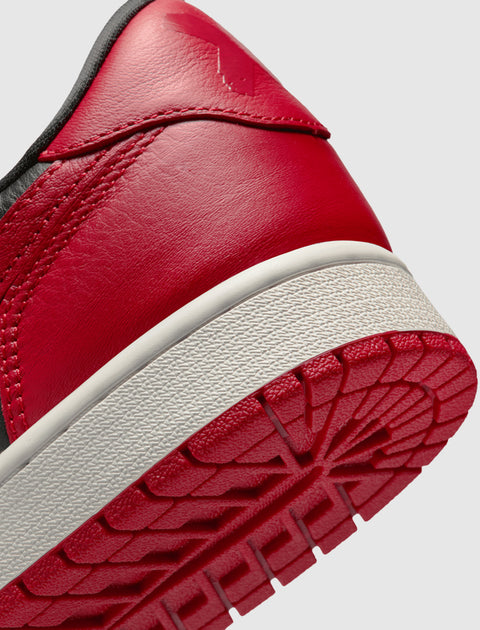 Close-up of red and white leather sneaker heel and outsole with textured tread