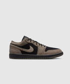 Black and olive grey low-top sneaker with textured leather and swoosh, streetwear style