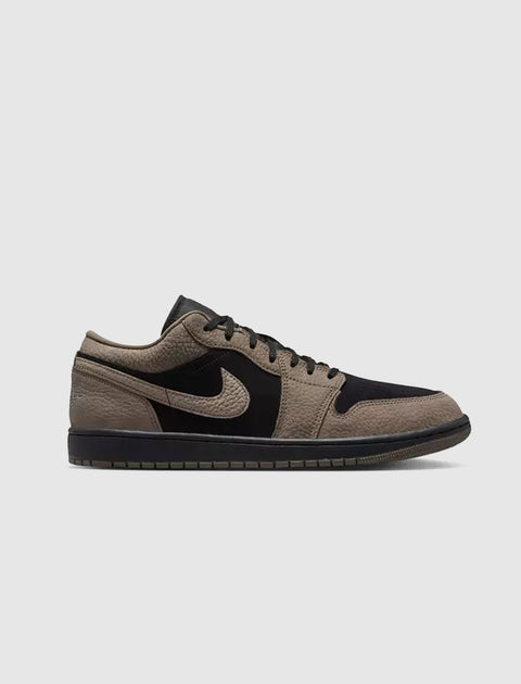 Black and olive grey low-top sneaker with textured leather and swoosh, streetwear style