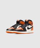 Black, orange, and white high-top sneakers with Nike swoosh logo on clean background