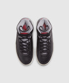 Black and grey high-top sneakers with red accents, viewed from above on white background