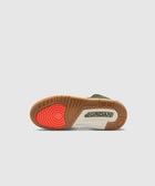 Basketball sneaker outsole with gum, white, and bright red details on sole