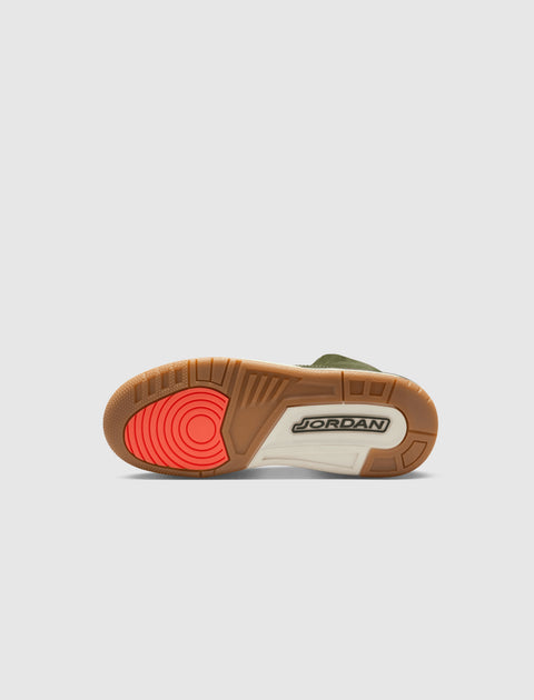 Basketball sneaker outsole with gum, white, and bright red details on sole