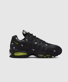 Black Air Max sneaker with ghost patterns and neon green accents on a white background