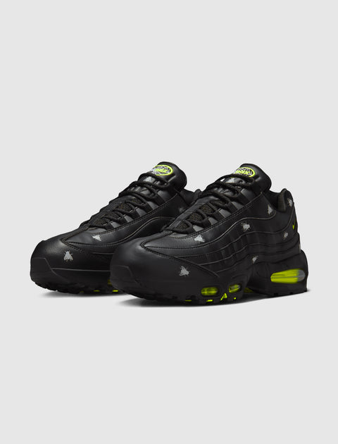 Black Nike Air Max 95 sneakers with green accents and Halloween-themed graphics