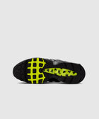 Black and neon sneaker outsole with bug graphic details and Nike logo