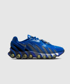 Blue athletic sneaker with mesh panels and visible air cushioning on chunky sole