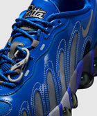 Blue men's streetwear sneaker with Patta branding, mesh panels, and unique outsole design