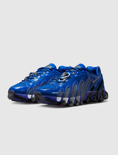 Blue low-top sneakers with wavy patterns, mesh panels, and unique cushioned soles