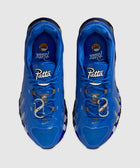 Top view of blue Patta Nike Air Max sneakers with silver accents on a gray background