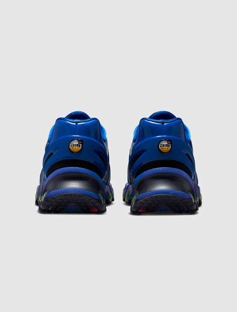 Rear view of blue men's sneakers with Air Max logo and black details on a grey background.