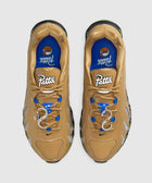 Top view of tan and blue men's streetwear sneakers with white Patta logo and unique lace details