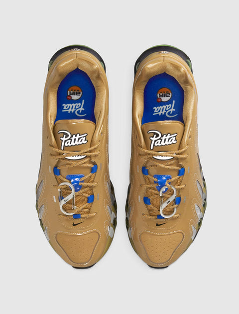 Top view of tan and blue men's streetwear sneakers with white Patta logo and unique lace details