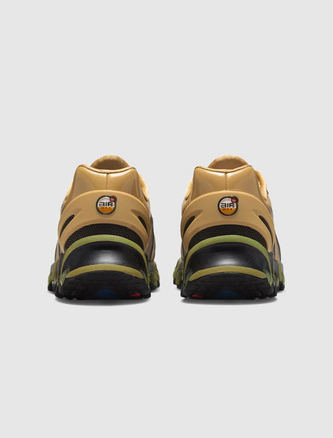 Rear view of tan and olive green Air Max sneakers on a white background