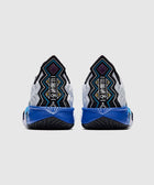 Men's sneakers with bold geometric patterns, blue soles, and black and white details, rear view