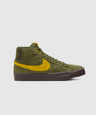 Olive green suede high-top sneaker with yellow swoosh and dark sole, side view