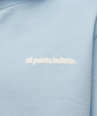 Light blue streetwear hoodie with white all points bulletin text on chest