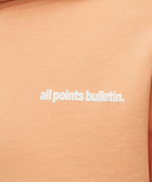 Peach pink hoodie with 'all points bulletin.' white text on chest, men's streetwear apparel