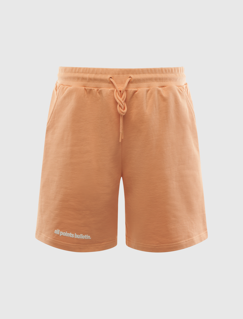 Light orange men's streetwear shorts with drawstring waist and small logo print