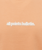 Peach pink streetwear t-shirt with white all points bulletin text embroidered on chest