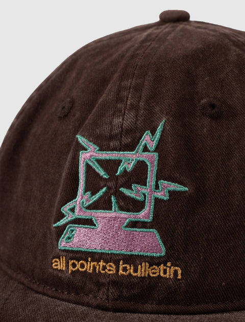 Brown corduroy hat with colorful embroidered computer graphic and 'all points bulletin' text