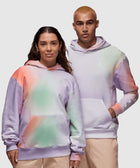 Two models wearing pastel tie-dye hoodies and beige pants, casual streetwear style.