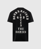 Black streetwear t-shirt with bold white gothic text reading 'Born X Raised God Loves The Homies' on back.