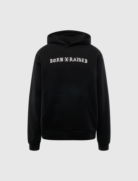 Black streetwear hoodie with BORN X RAISED text, front kangaroo pocket, and drawstring hood