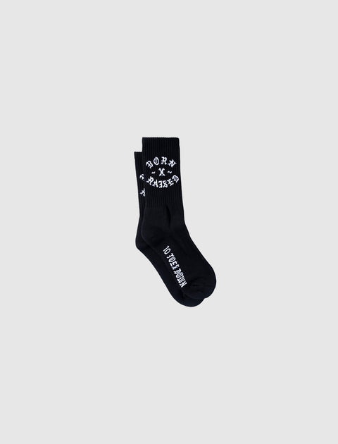 Black crew socks with white 'BORN X RAISED' text, streetwear men's apparel.