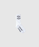 White crew socks with black Born X Raised text and graphics, isolated on light background