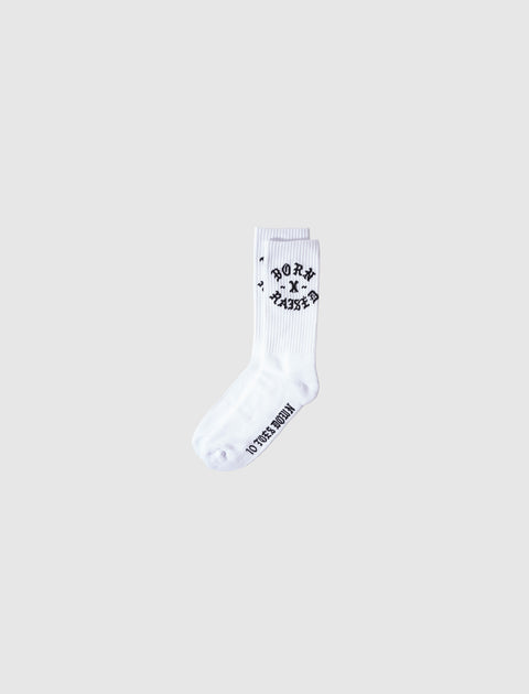 White crew sock with black Born x Raised lettering, streetwear apparel on light background