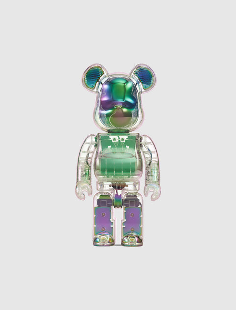 Clear iridescent bear-shaped collectible toy figure with metallic green and purple hues