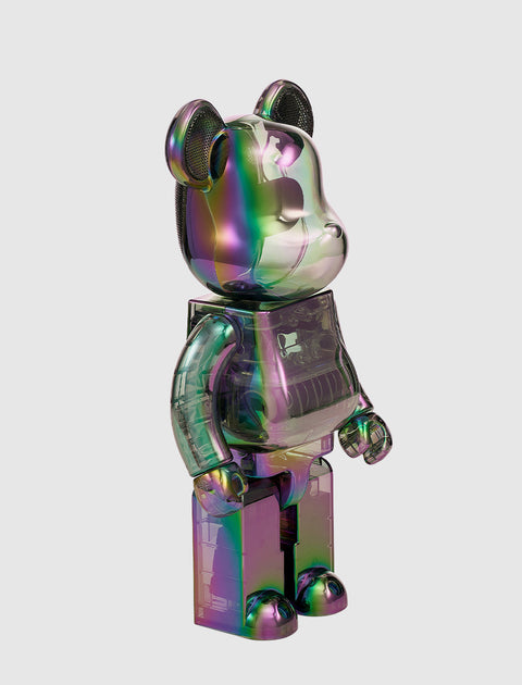 Iridescent translucent bear collectible toy figure on a light gray background