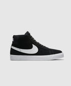 Black and white high-top sneaker with white sole and side swoosh logo on gray background
