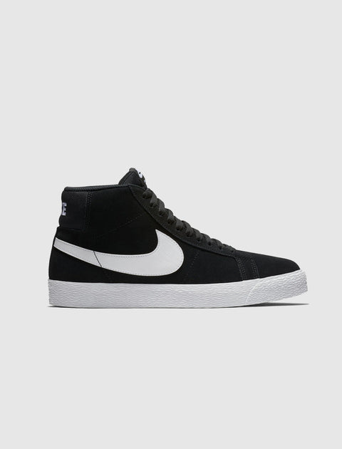 Black and white high-top sneaker with white sole and side swoosh logo on gray background