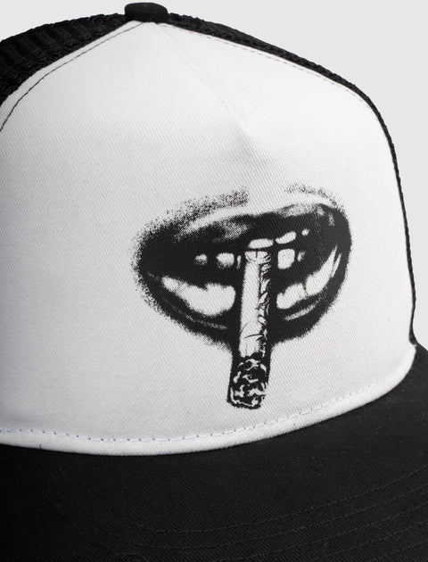 Black and white trucker hat with graphic of lips holding a rolled cigarette on the front panel.
