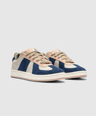 Men's low-top sneakers with blue suede panels, beige accents, and textured laces on white sole