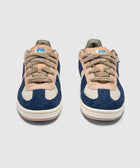 Men's blue and beige textured sneakers with suede details and thick tan laces, front view