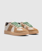 Men's streetwear sneakers with brown suede panels, cream accents, and green laces